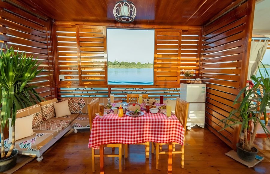 Dining area on the sundeck of a Royal Cleopatra Dahabiya Nile Cruise boat.