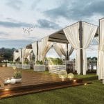 Luxury Nile cruise sundeck with curtained cabanas, wooden deck, and evening lighting.