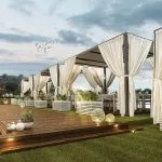 Luxury Nile cruise sundeck with curtained cabanas, wooden deck, and evening lighting.