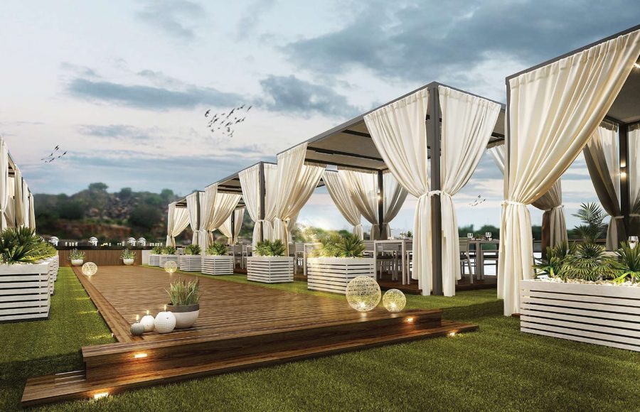 Luxury Nile cruise sundeck with curtained cabanas, wooden deck, and evening lighting.