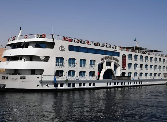 White Nile Cruise Ship With Blue Windows On The Water.