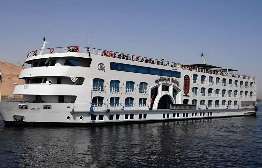 White Nile Cruise ship with blue windows on the water.