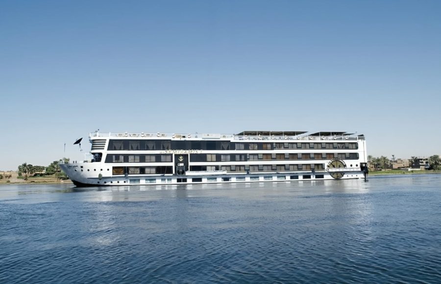 Luxury Nile cruise ship MS Royal Signature sailing on the Nile River on a sunny day.