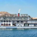The classic Mövenpick SS Misr Steamer Nile Cruise sailing past desert landscapes.