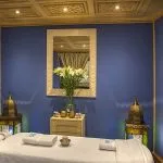 A serene spa treatment room with a massage bed and ambient lighting on the Sphinx Nile Cruise