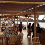 A picture of the Sacred Lotus Dahabiya cruise sundeck set up for dining on the Nile River.