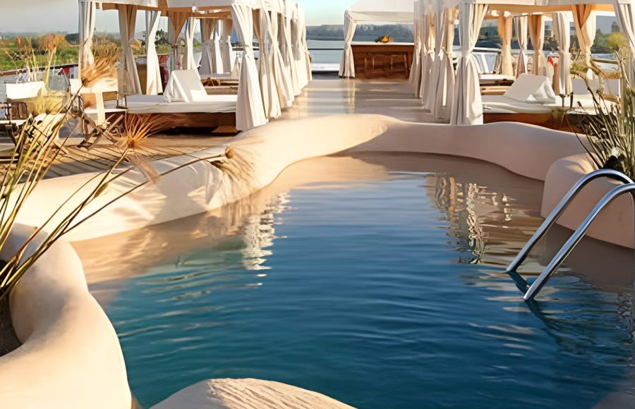 A luxurious Arabian-themed sundeck with a mosaic-tiled plunge pool on the Sanctuary Zein Nile Chateau dahabiya.