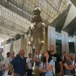 A traveler capturing the modern facade of the building on a short trip to Grand Egyptian Museum