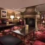 The lounge with a fireplace on the Steigenberger Regency Nile Cruise.