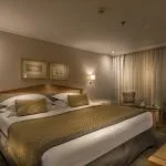 A king-sized bedroom on the Steigenberger Regency.