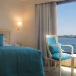 The bedroom area of a suite on the Steigenberger Regency Nile Cruise.