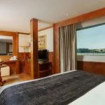 King bed suite with a river view window on MS Grand Rose Nile Cruise.