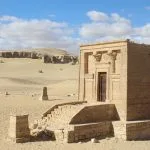 Tourists exploring the open-air foundations and column bases of the ancient city of Tell Amarna on a fascinating Tell Amarna tour