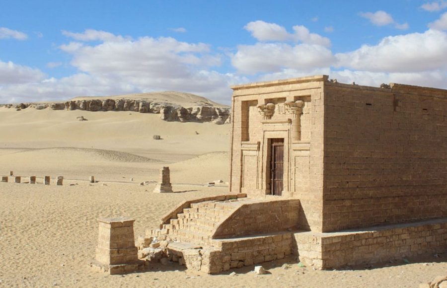 Tourists exploring the open-air foundations and column bases of the ancient city of Tell Amarna on a fascinating Tell Amarna tour