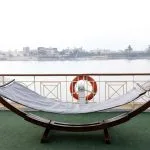 Hammock on cruise ship deck overlooking the Nile River.