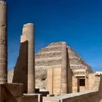 The well-preserved stepped facade and entrance gate with stone columns of The Step Pyramid of Zoser in Saqqara Egypt, a key historic stop on a typical 7 day egypt itinerary with beach.