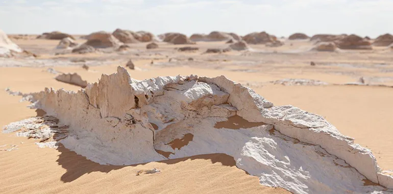 Surreal White Chalk Rock Formations Rising From The Sandy Desert Floor In The White Desert, Egypt.