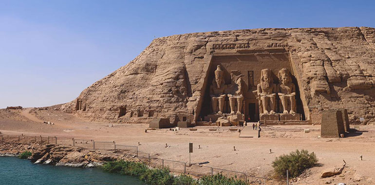 The Main View Of An Entrance To The Great Temple At Abu Simbel Faced The Nile With Ancient Colossal Statues Of Ramesses Ii