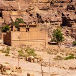 Top-view-of-the-side-of-Qasr-al-Bint-temple-complex-with-mountains-in-background-archaeological-site-of-petra-jordan