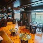 Interior of a dark wood library/lounge on a Nile cruise ship.