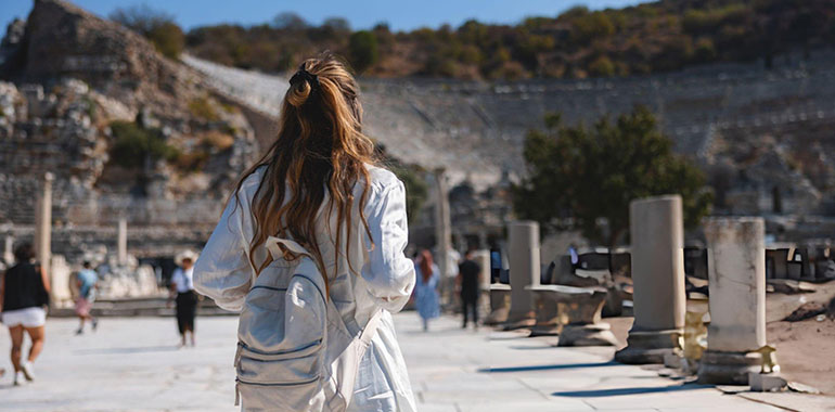 Tourist Exploring the Ruins of the Ancient Greek Theatre of Ephesus