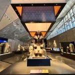 Statue of a pharaoh inside the main hall during a Grand Egyptian Museum tour