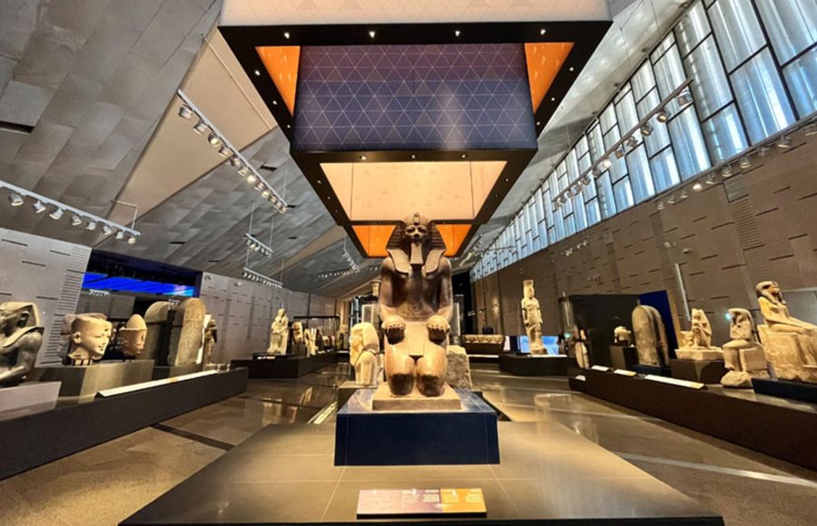 Statue of a pharaoh inside the main hall during a Grand Egyptian Museum tour