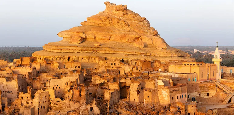 View Of The Majestic Mud-Brick Ruins Of The Shali Fortress Towering Over The Siwa Oasis, A Highlight Of The Western Desert Oases.