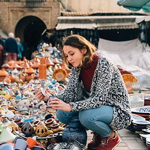 Woman choosing Ceramic in shop in Meknes Morocco at her 13 day Egypt Morocco Nile cruise Fez and Marrakech tour