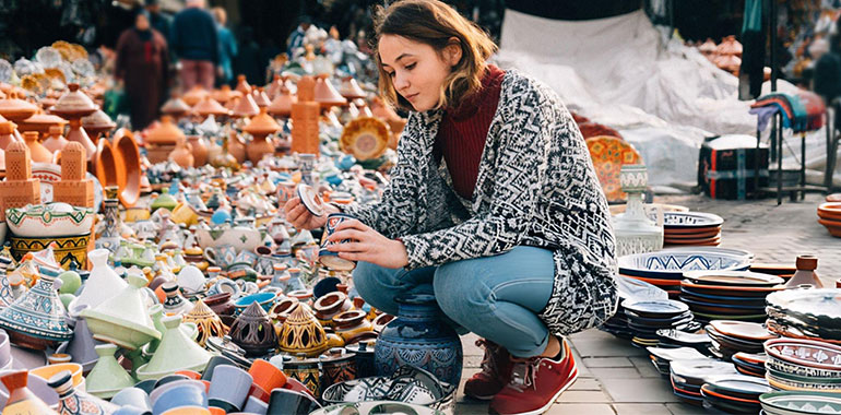 Woman choosing Ceramic in shop in Meknes Morocco