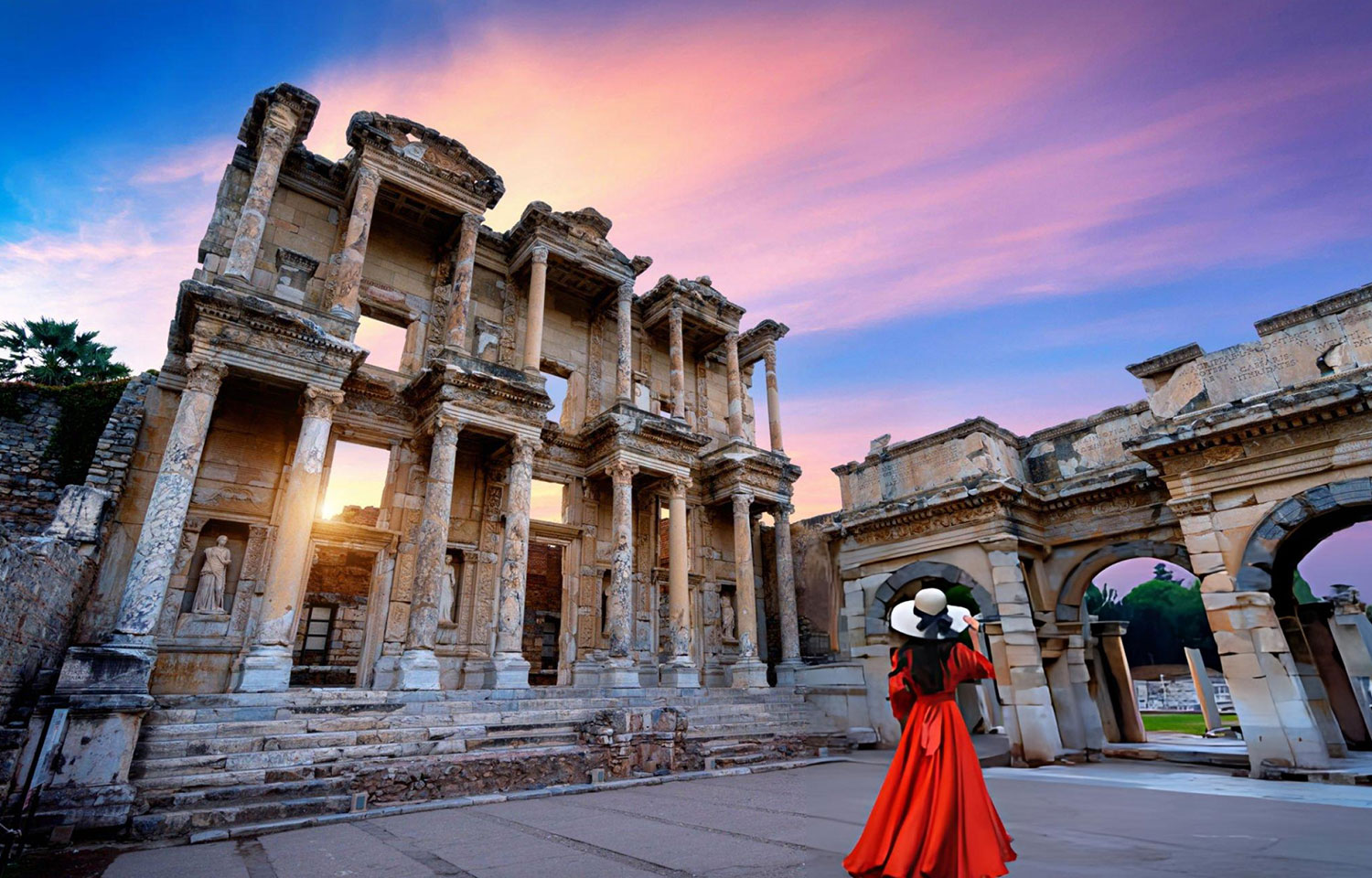 Woman standing in Celsus Library at Ephesus ancient city in Izmir Turkey 1
