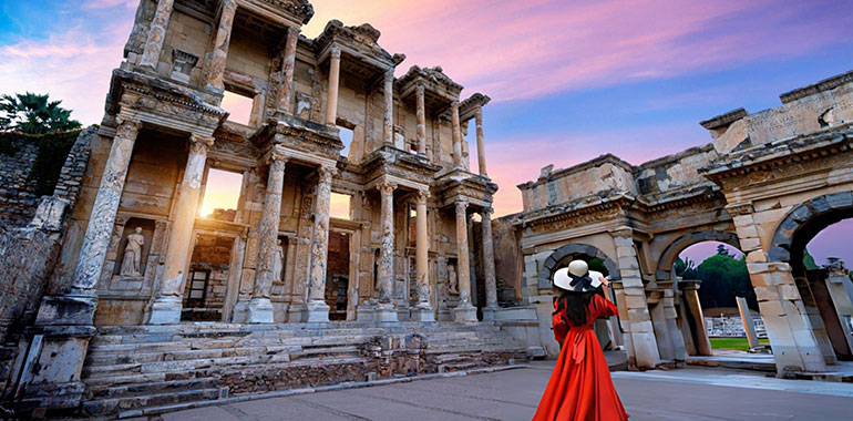 Woman standing in Celsus Library at Ephesus ancient city in Izmir Turkey