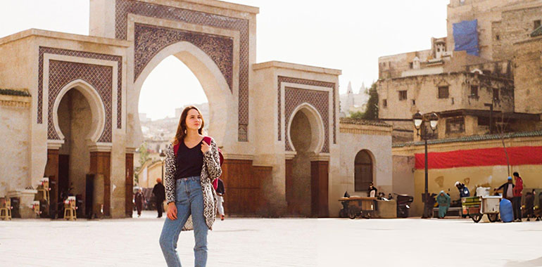 Woman standing near the Bab Boujeloud in Fez