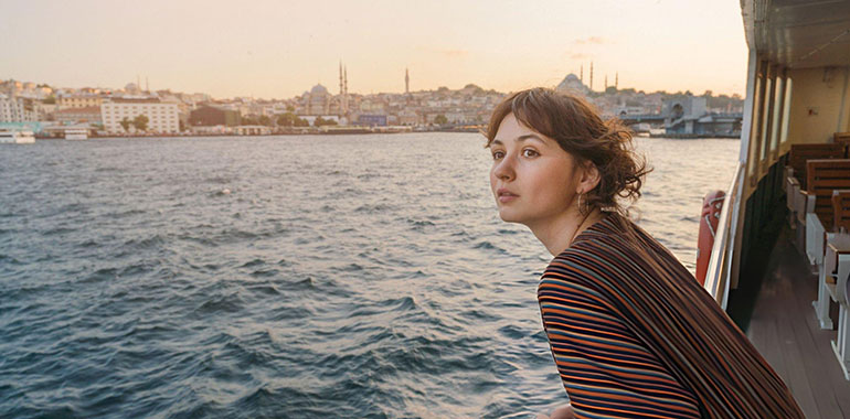 Woman traveling on ferry through Bosphorus in Istanbul