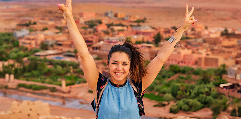 Young tourist visiting Ait Benhaddou Ancient city in Morocco 1