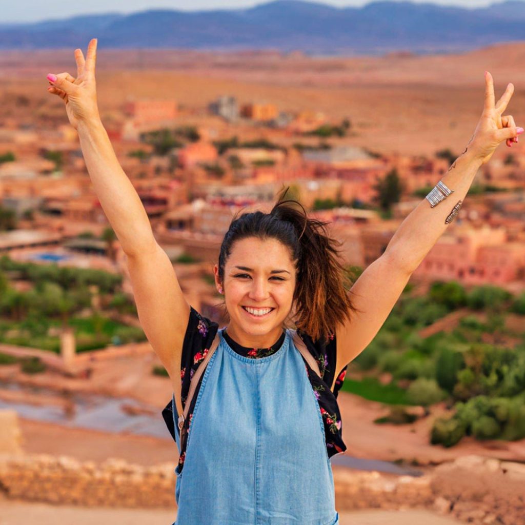 Young tourist visiting Ait Benhaddou Ancient city in Morocco