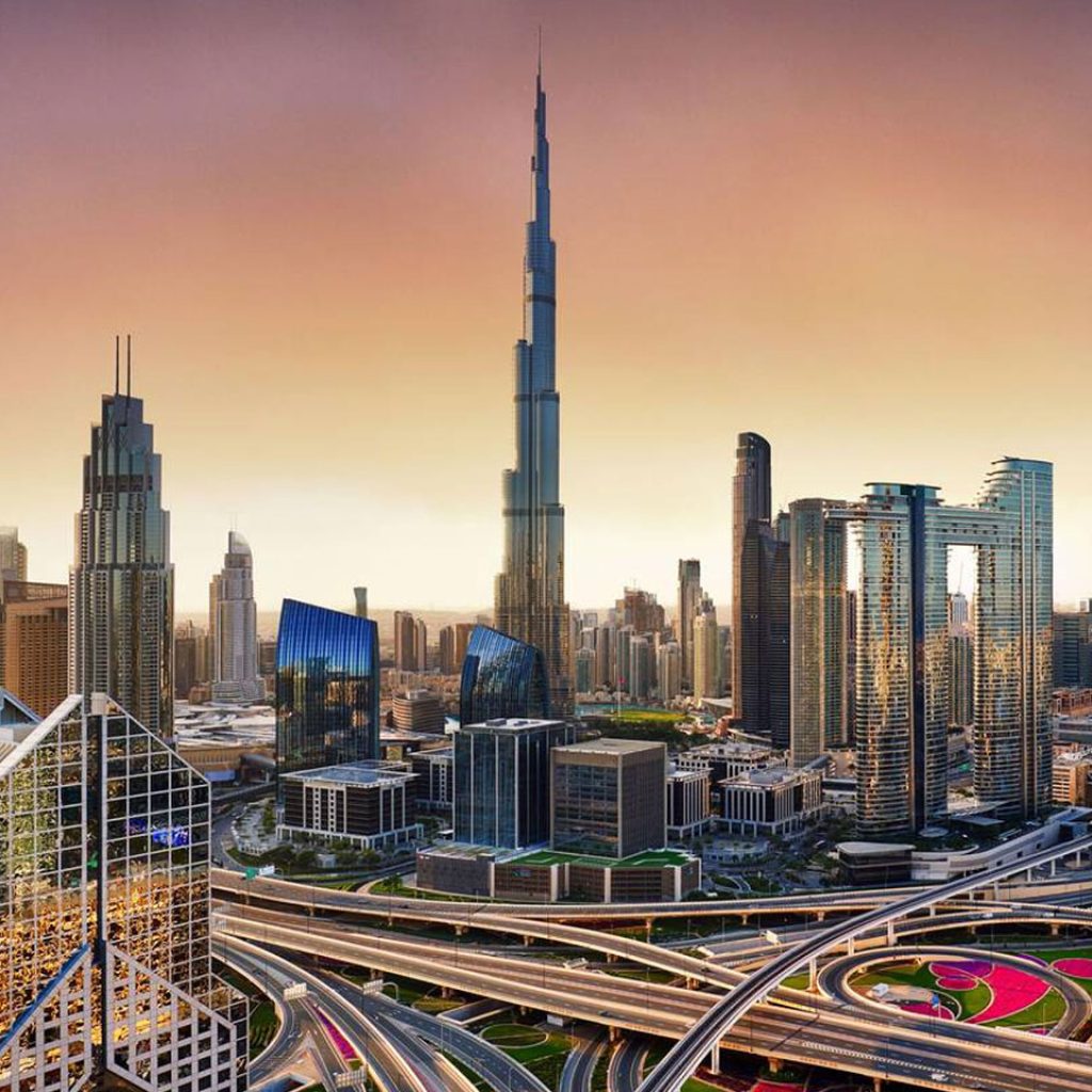 aerial view of Dubai skyline at sunset with Burj Khalifa