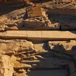 A bird's-eye view of the Unfinished Obelisk still embedded in the bedrock at the Aswan quarry, showing its immense size and the marks of ancient carving techniques.