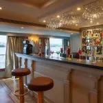 Close-up of a colorful, elaborately garnished buffet spread with salads and appetizers.