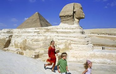 A family at the Pyramids, a highlight of any 7 day Nile Cruise Itinerary.