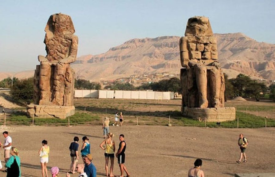Tourists admiring the Colossi of Memnon in Luxor, a spectacular highlight of short Egypt tours and travel itinerary ideas