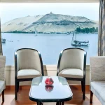 A lounge area with panoramic Nile River view,—a perfect scene on your 7 day Nile Cruise Itinerary.