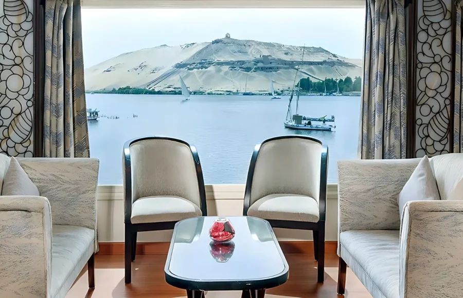 A lounge area with panoramic Nile River view,—a perfect scene on your 7 day Nile Cruise Itinerary.