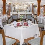 An elegant dining room on a Nile cruise ship, offering fine dining throughout the 7 day Nile Cruise Itinerary.