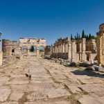 main-street-with-Frontinus-Gate-or-Nothern-Gate-in-Greek-Hierapolis-Pamukkale-Archeological-Site-Pamukkale-Denizli-Turkey