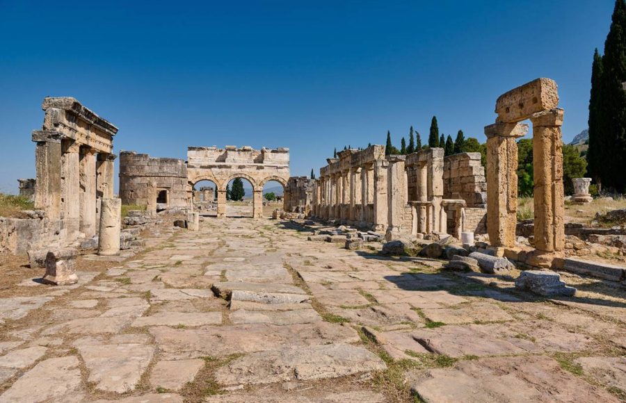 main-street-with-Frontinus-Gate-or-Nothern-Gate-in-Greek-Hierapolis-Pamukkale-Archeological-Site-Pamukkale-Denizli-Turkey