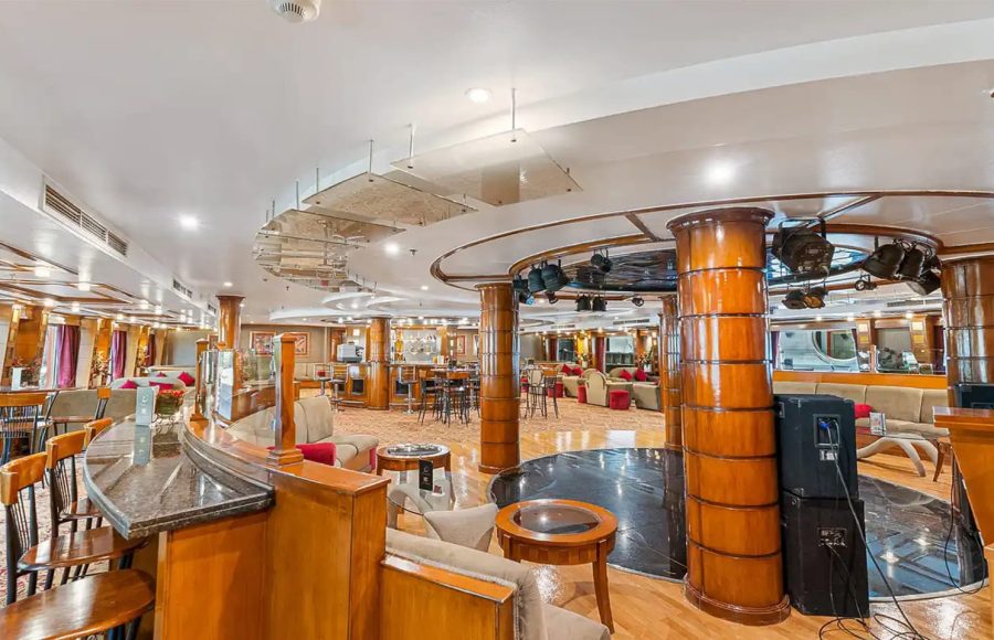 Spacious cruise ship lounge and bar with dance floor.
