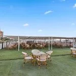 Nile cruise sundeck dining area with tables and chairs.