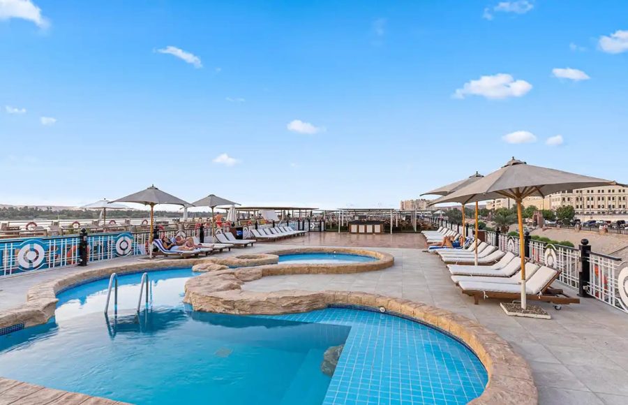Nile cruise sundeck with swimming pool and loungers.