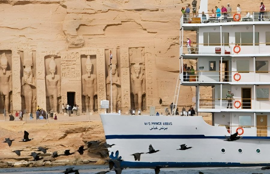 The Mövenpick Prince Abbas cruise ship sailing on deep blue water under a clear sky.